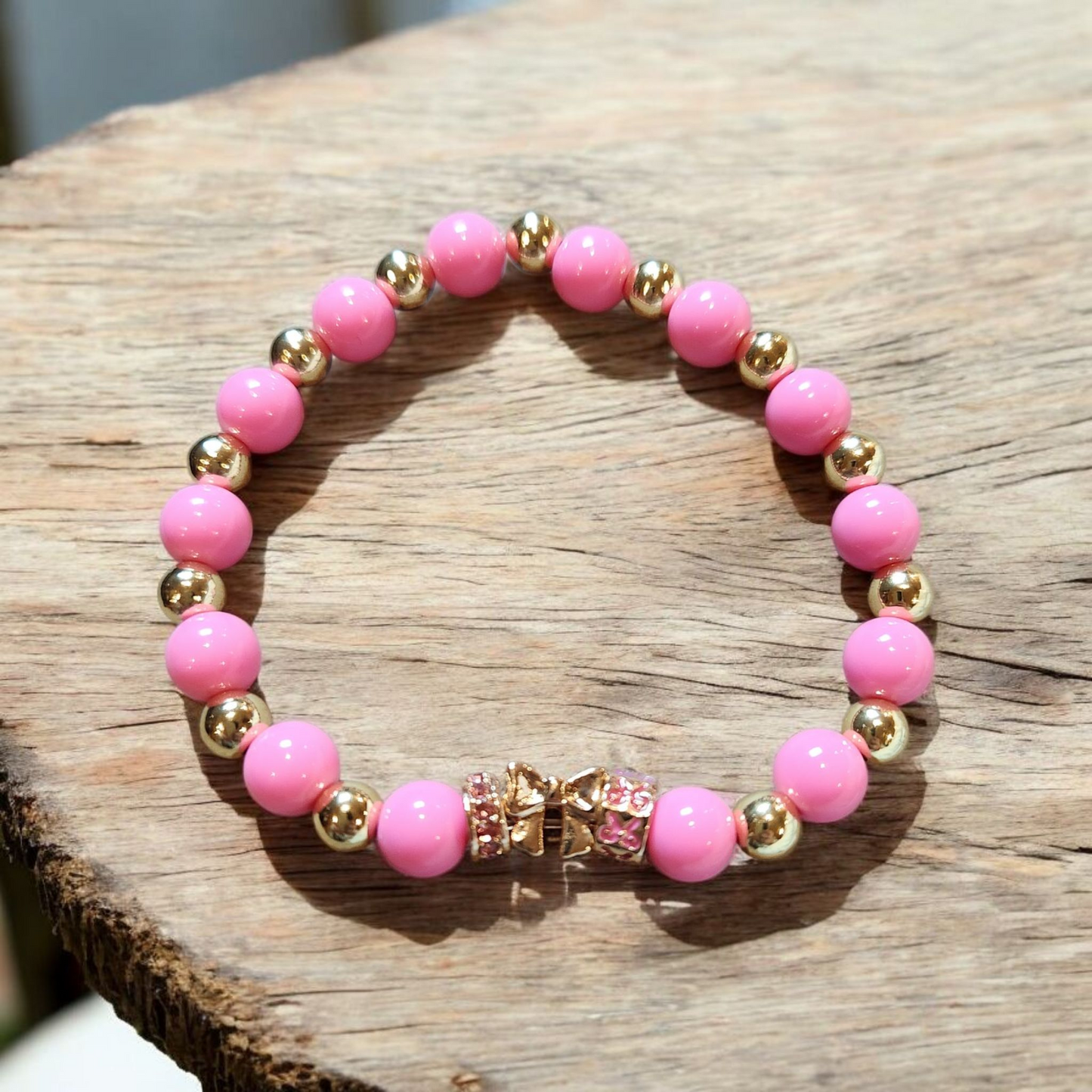 Pink And Gold With A Golden Bow Charm Bracelet